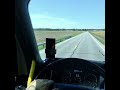 POV Inside of a fully loaded Big Rig Semi Truck 18 Wheeler racing down an old country road. (2)