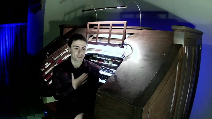 Organist Nathan Avakian plays the Kimball organ in...