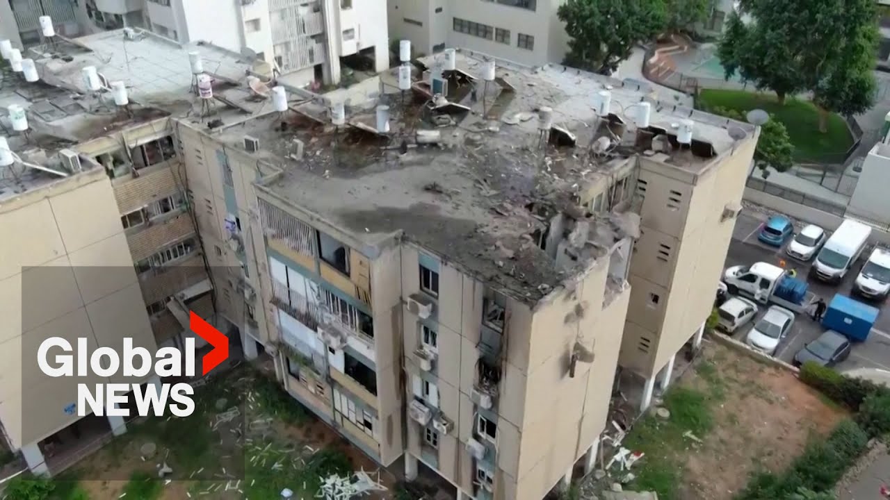 Rocket strike hits Tel Aviv apartment building, wounding at least 4: IDF military district command Rocket strike hits Tel Aviv apartment building, wounding at least 4: IDF military district command