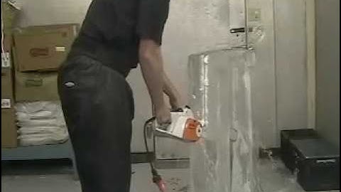 Ice sculpting technique: splitting an ice block with a chainsaw