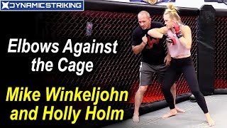 Elbows against the Cage by Mike Winkeljohn and Holly Holm