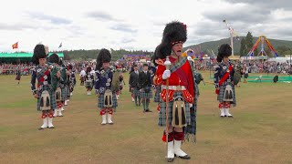 Drum Major Ian Esson Leads Ballater Pipe Band And Drum Majors During 2022 Aboyne Highland Games