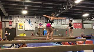 Split jump, tuck three quarter on beam
