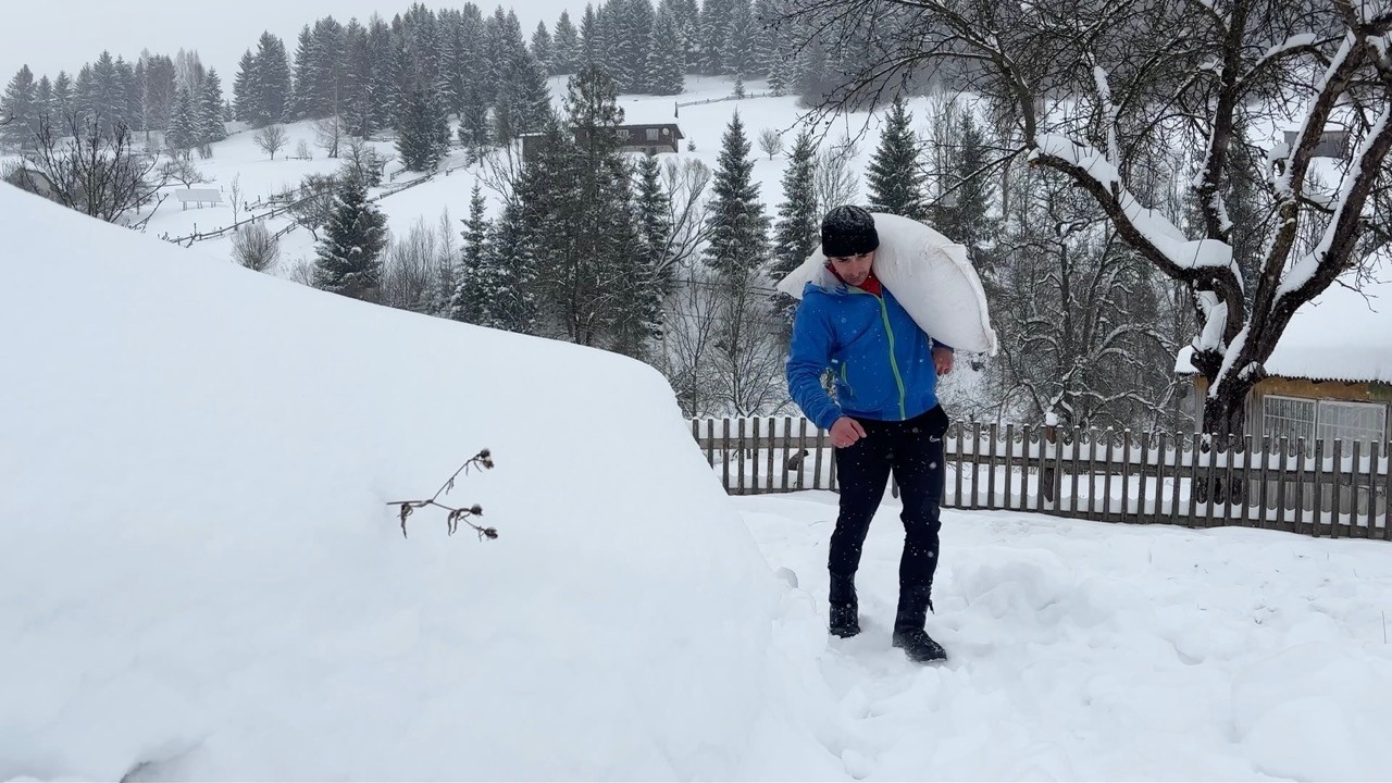Calm life of a husband with his daughter in the snowy Carpathians