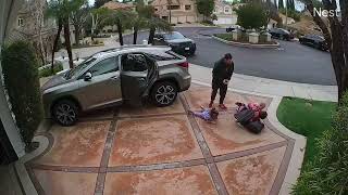 Woman takes baby out of car seat then turns around and trips over little girl (Security camera)