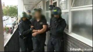 Riot police raid suspected looters in London