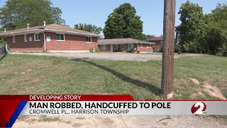 Investigation ongoing after a man is robbed and handcuffed to a utility pole