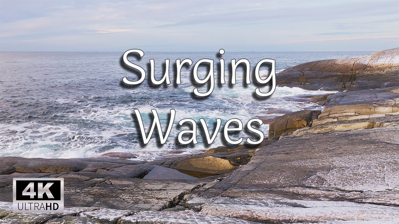 Waves surging over a rugged winter shoreline