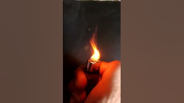 "Experience the Fascinating Moment: A Lighter Sparks into Flame Captured in Stunning Slow Motion"