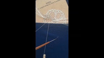 Bobbin lacemaking - sewing ends in with a crochet hook and Lazy Susan
