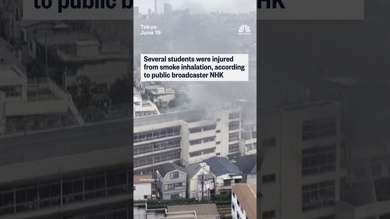 Japanese students on ledge await for rescue from fire