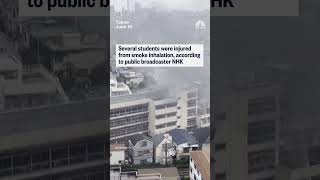 Japanese students on ledge await for rescue from fire