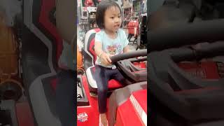 Nary is excited about riding on the seated operated lawn mower at Lowe's #shorts #lowesdeal