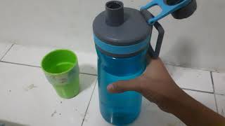 How to pour drinking water from a bottle to a cup