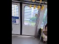 A train in Singapore with windows that automatically blind when passing residential blocks.