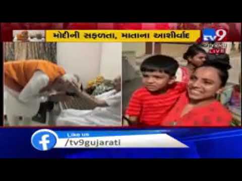 PM Modi gives autograph to people gathered at mother Hiraba's residence in Gandhinagar