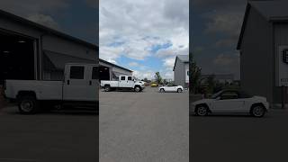 The Contrast Of Vehicles At The Shop Is Wild.
