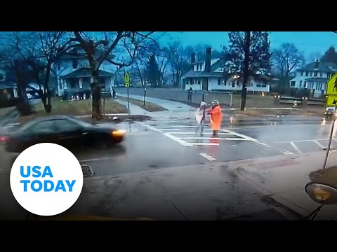 Officer gets hit by a car instead of student | USA TODAY