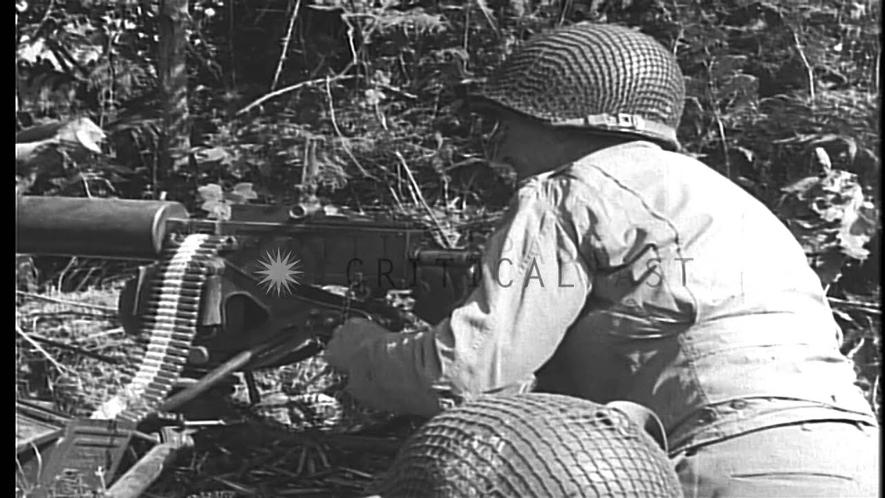 American soldiers fire a 30 caliber water cooled machine gun in