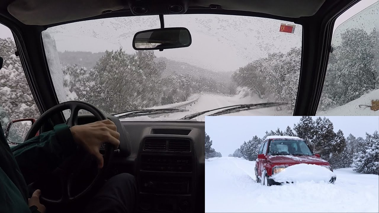 Suzuki Vitara sliding on deep snow