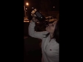 Young girl drinking a whole bottle of whiskey in one minute