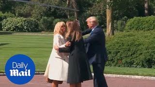 Emmanuel Macron and wife Brigitte arrive for D-Day commemoration