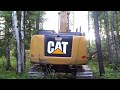 Excavator clearing trees