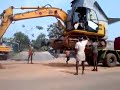 JCB accident while unloading from truck, poor and stupid driving