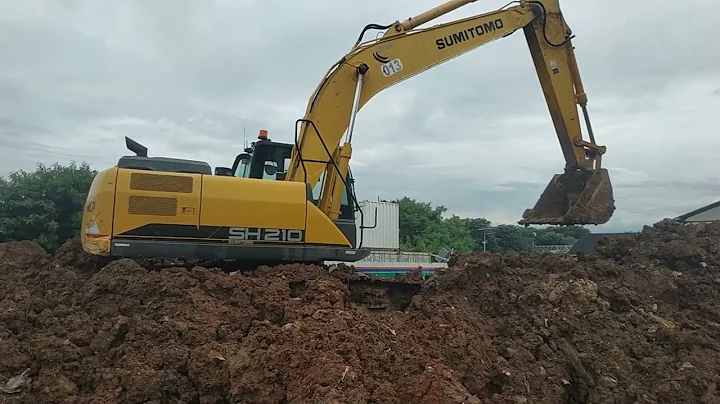 excavation and removal of muddy soil with the Sumitomo SH 210 excavator.