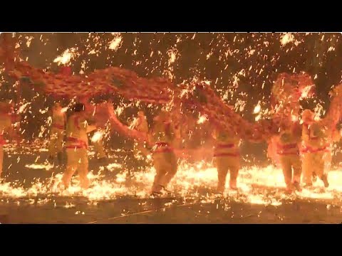 dragon dance in splashing molten iron adds to new year atmosphere in