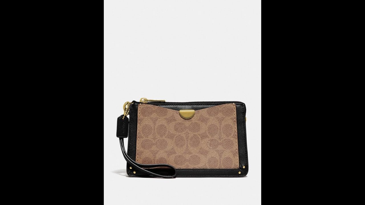dreamer wristlet in signature canvas