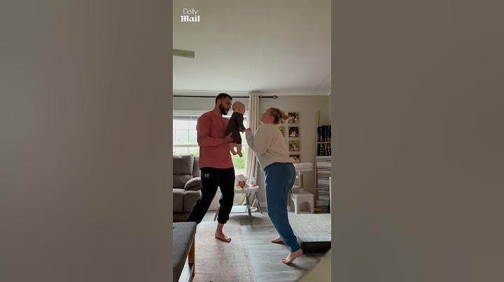 Baby giggles with joy at mom's dancing