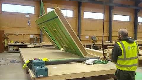 PYC offsite timber frame manufacture.  Flipping a panel