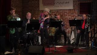 Brass Ackwards  plays  See Saw