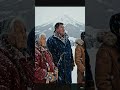 We stands together beneath falling snow and an unshaken mountain.#nativeamerican  #indigenoushistor