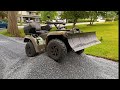 Spreading Gravel In A Driveway With An ATV