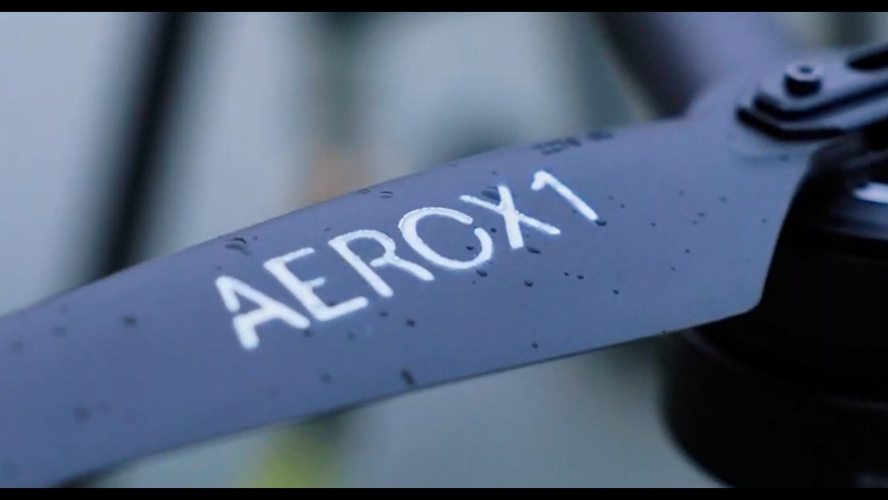 Aerial drone cleaning a commercial building facade in Boston