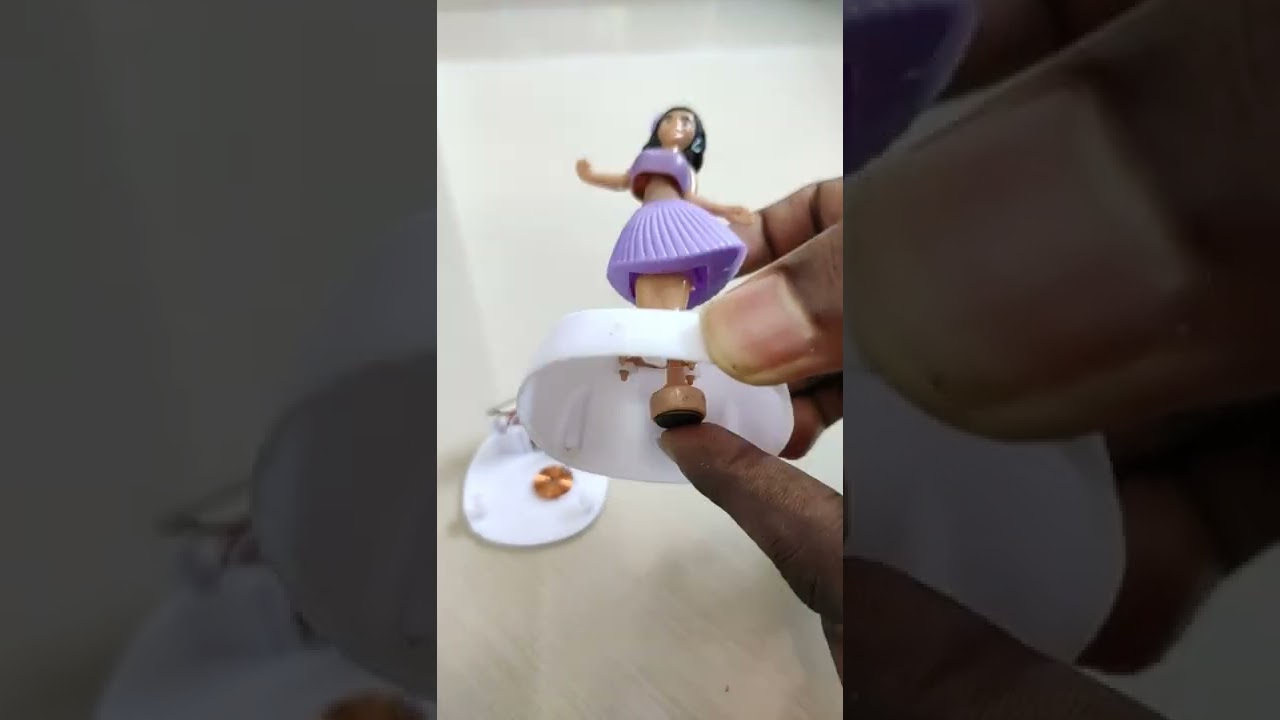 Inside solar dancing girl - hula doll - (solar panel, copper coil, magnet)