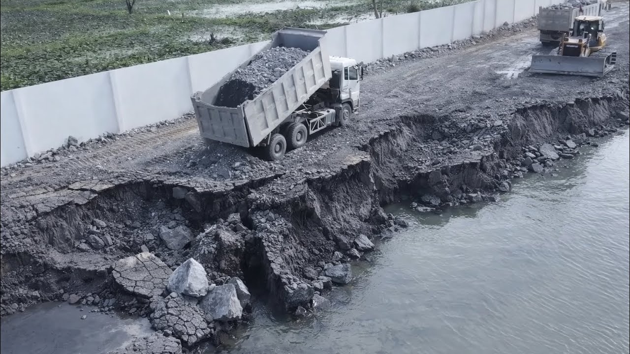 Dump Trucks Loading Stone Repair Crack And Sink Land SHANTUI Dozer