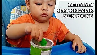 Bayi Usia Satu Setengah Tahun Bermain Dan Belajar Menabung