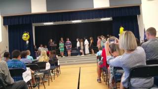Preston 5th grade class getting graduation  pins