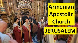 During Holy Week, a procession of the Armenian in Jerusalem enters the Church of the Holy Sepulchre