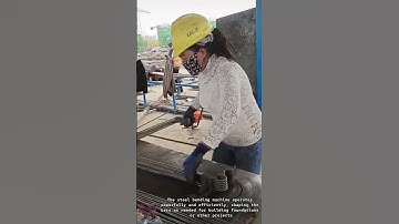 Construction Worker Bends Steel Bars: Rebar Reinforcement for Concrete Structures