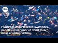 Hundreds of surfers and swimmers paddle out in honor of Bondi Beach mass shooting victims