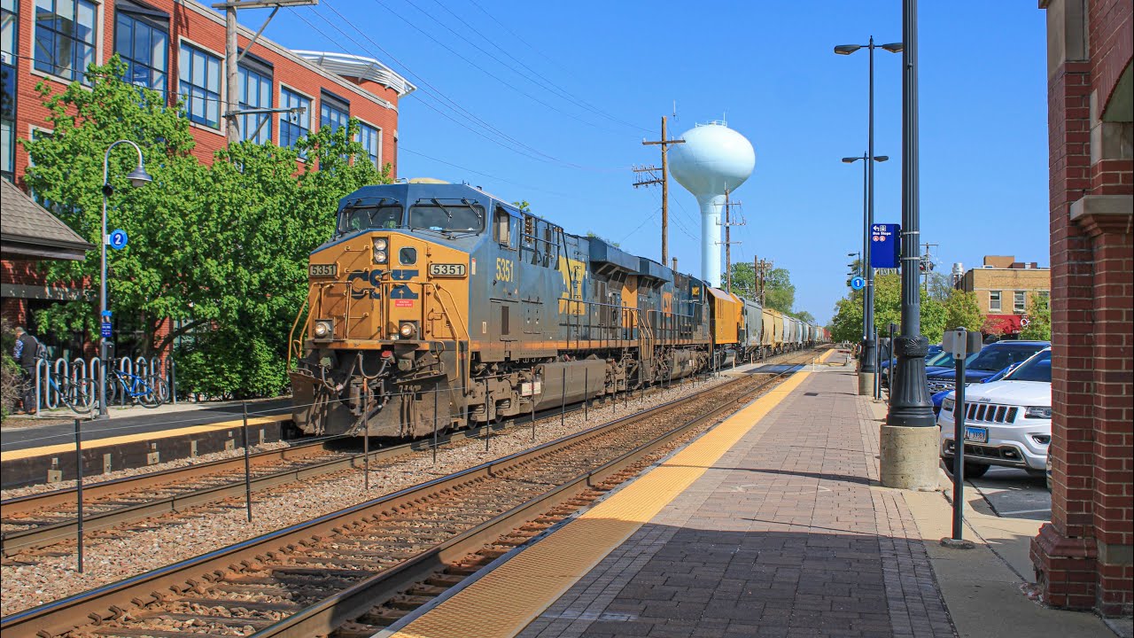 CSXT 5351 lugs CPKC 246 thru Northbrook with LMIX 7003 (LORAM) trailing ...