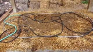 A quick look at how my husband set up a layer of straw and a soaker hose to cure cement to its maximum strength potential. See 