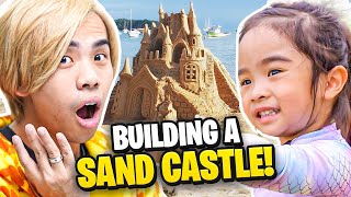 Teaching Our 3 Year Old Daughter How To Build A Sandcastle