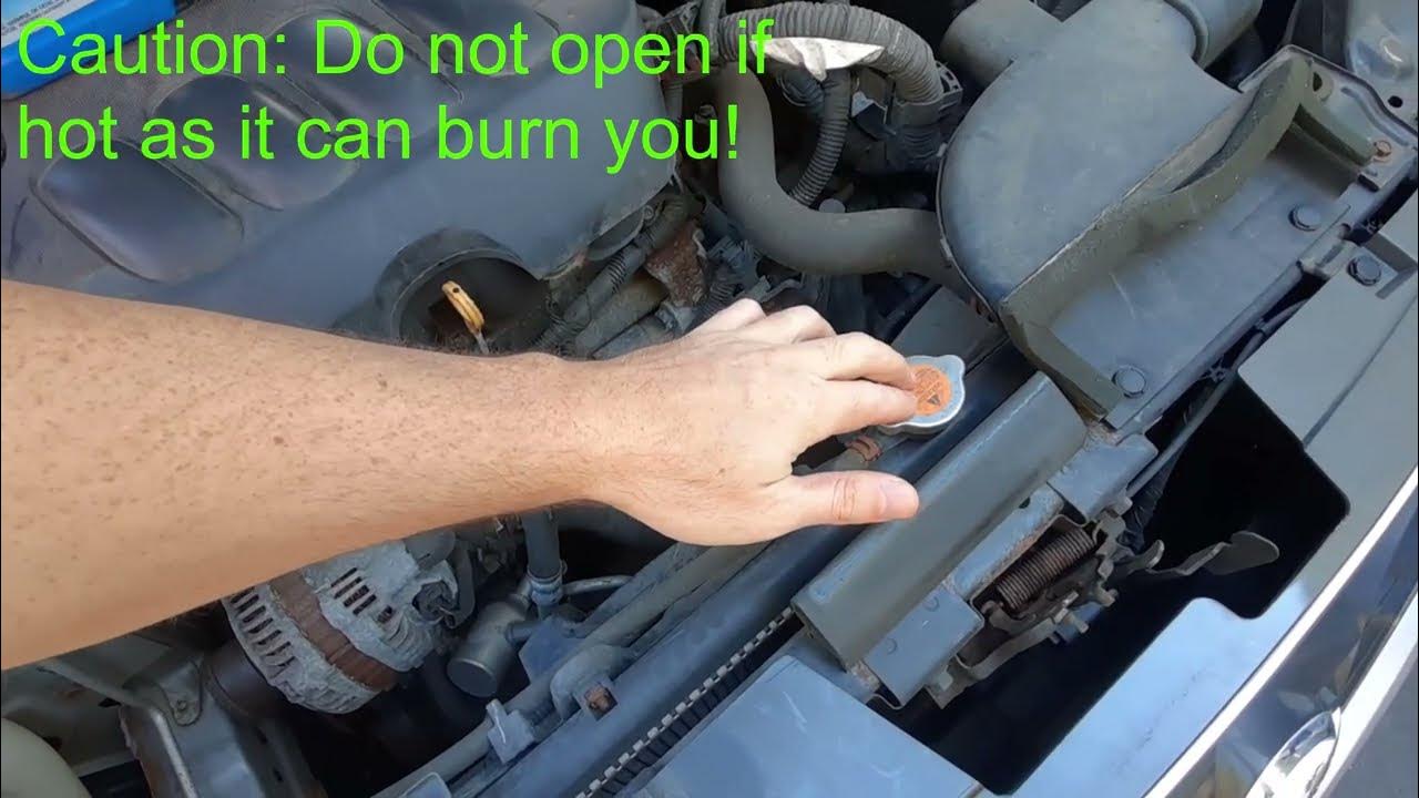 How to Refill Antifreeze / Coolant in a Nissan Sentra (2012 shown