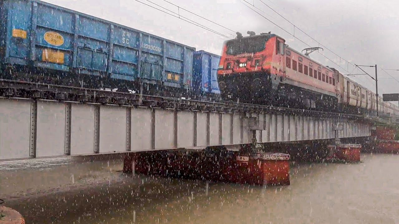 Train in extremely Heavy Rain ! superfast train overtake freight train over the julka bridge