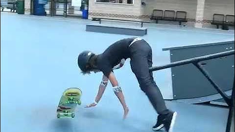 Skater fails and gets racked doing a boardslide